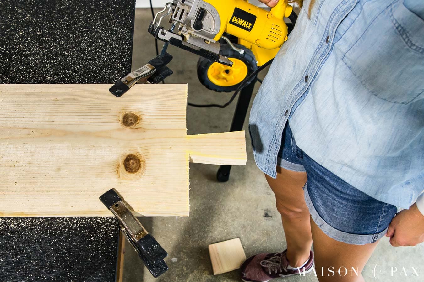 using jigsaw to cut out handle of antique bread board | Maison de Pax
