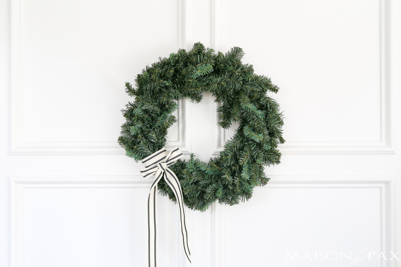 wrap a pretty ribbon onto a cheap wreath to great a gorgeous, expensive look (and click for 4 other easy, affordable wreath ideas!) #christmaswreath