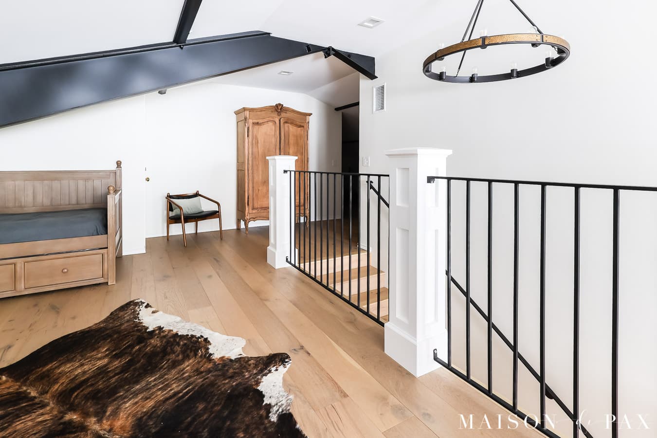 built out attic space with beautiful stripped antique armoire