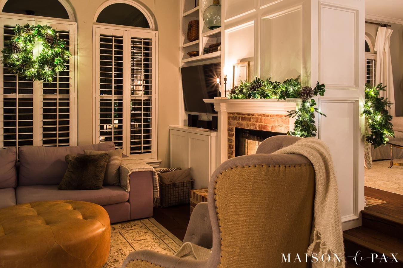 two sided fireplace with garland and Christmas lights | Maison de Pax