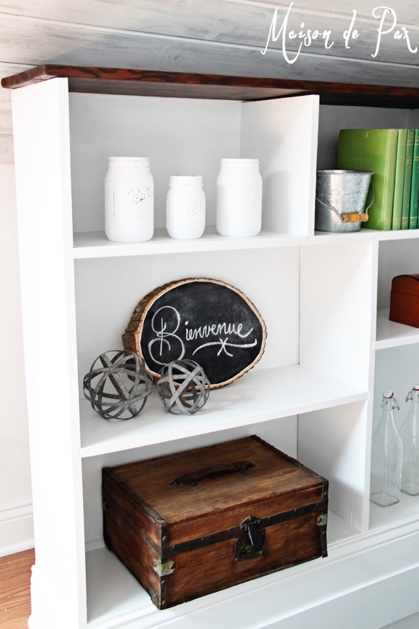 A DIY stairwell bookcase provides a creative and beautiful way to open the space and bring light into the stairwell.  Click through to see details and instructions!