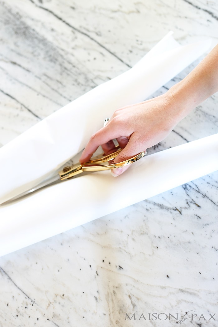 cut strips of butcher paper to make paper heart chain- Maison de Pax