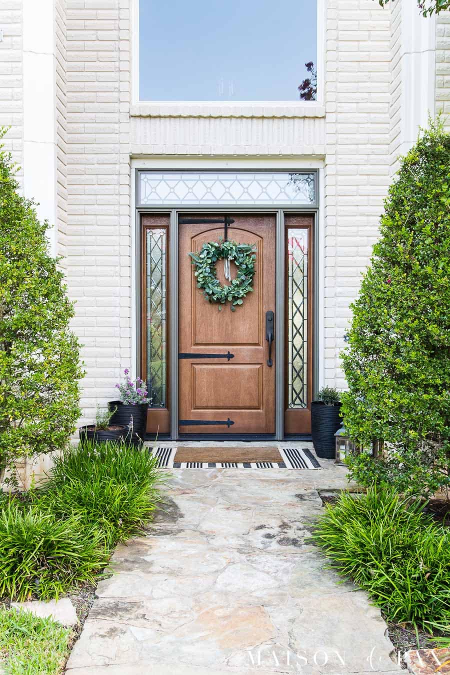 black accents on front porch of white brick house | maison de pax