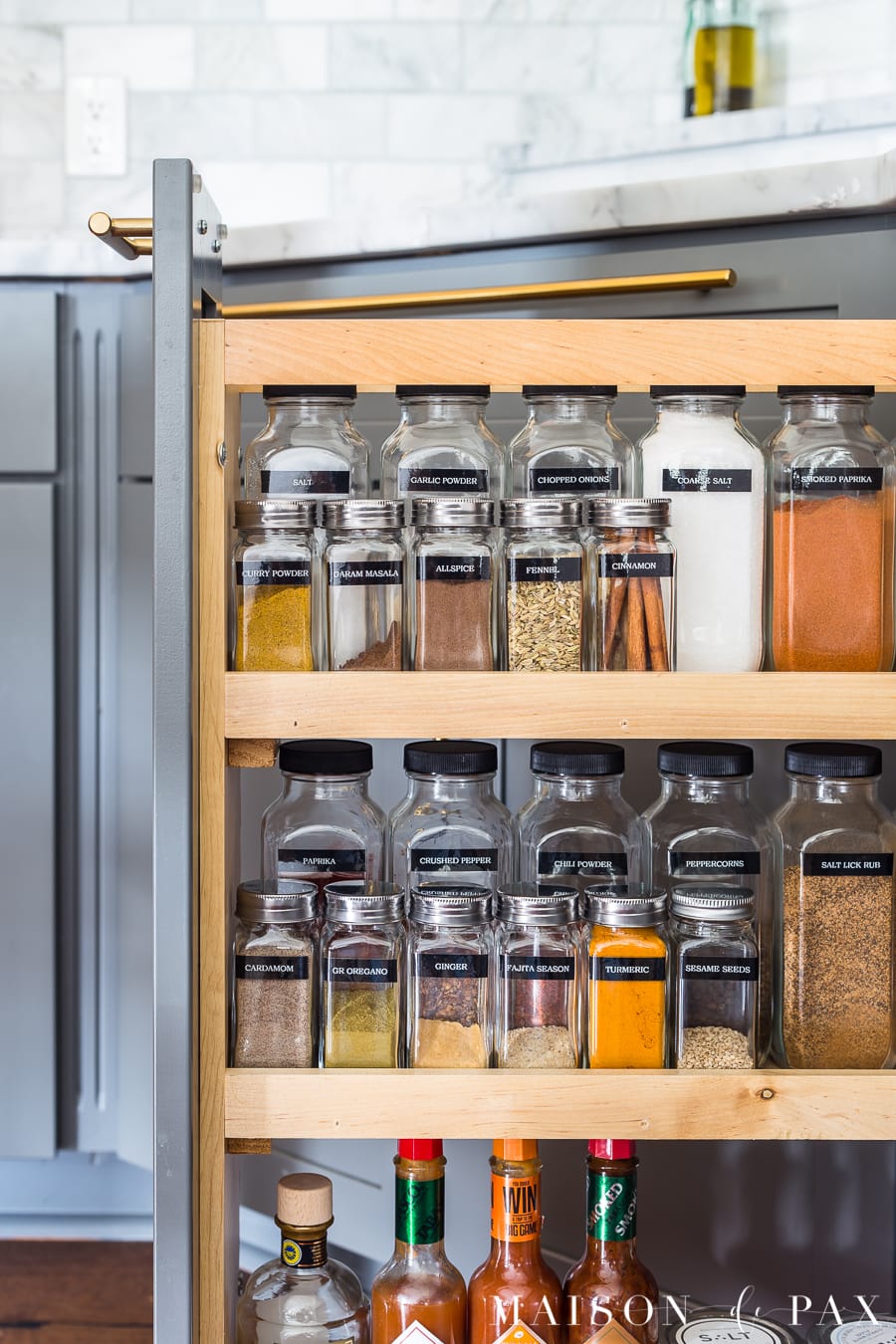 Find out where to get supplies to organize your spices just like this! #spiceorganizer #spiceorganization #spicecabinet #spicepullout #kitchenorganization #spiceorganizer #organize #organization