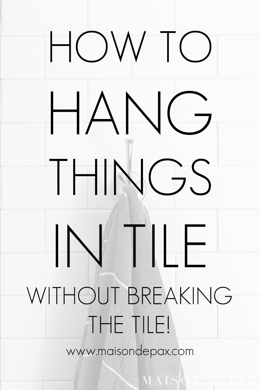 towel hook on white wall tile with overlay: how to hang things in tile | Maison de Pax