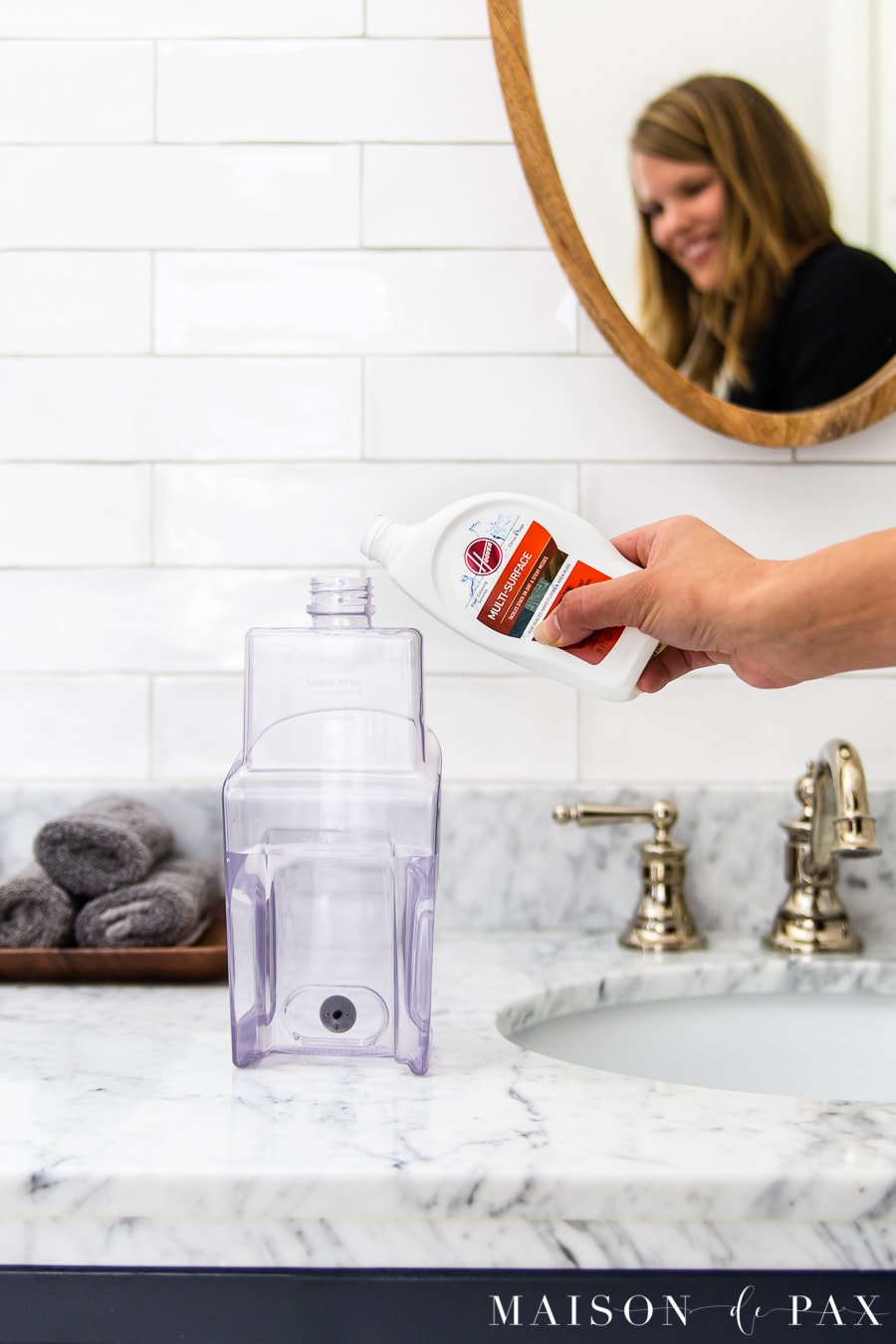 pouring cleaning solution into resevoir for Hoover ONEPWR Floormate Jet | Maison de Pax