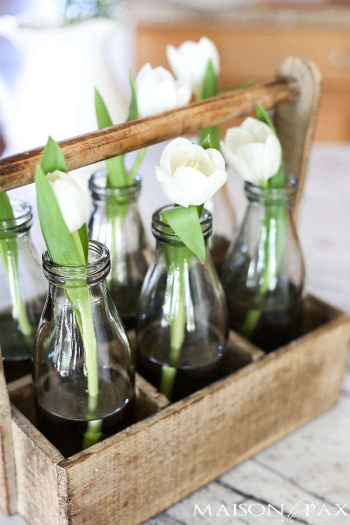 Single stem tulips in a rustic wood bottle caddy... Tips for quick and easy decorating with flowers | aiweb9ygdry.cmersite.com