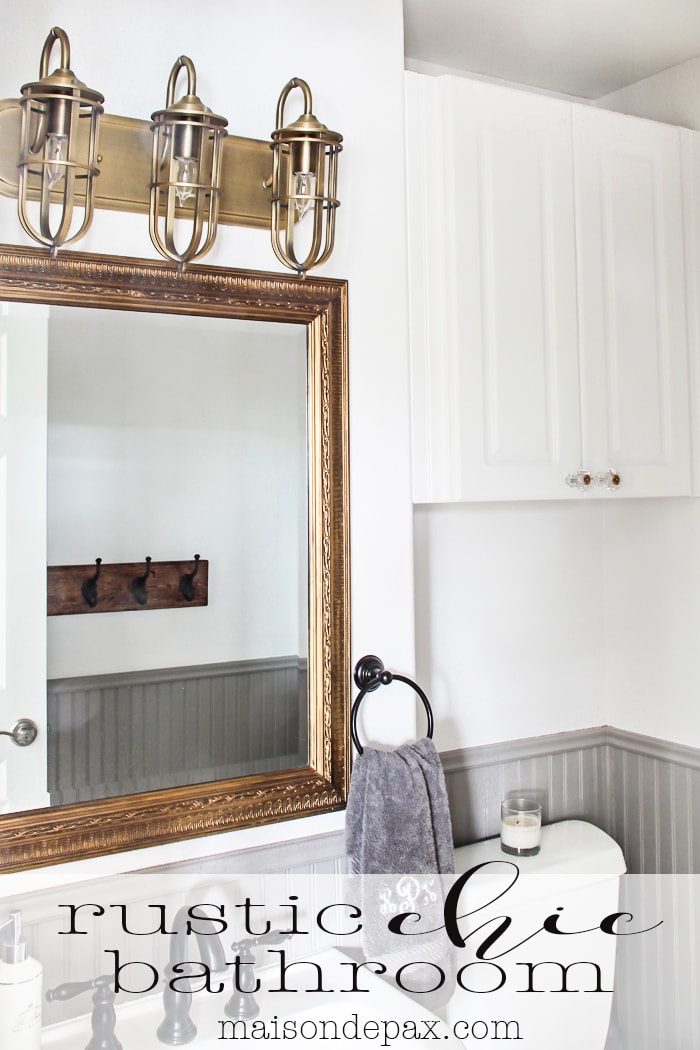 gorgeous rustic, chic bathroom: gold mirror, rustic wood towel rack... perfect balance of high and low | aiweb9ygdry.cmersite.com