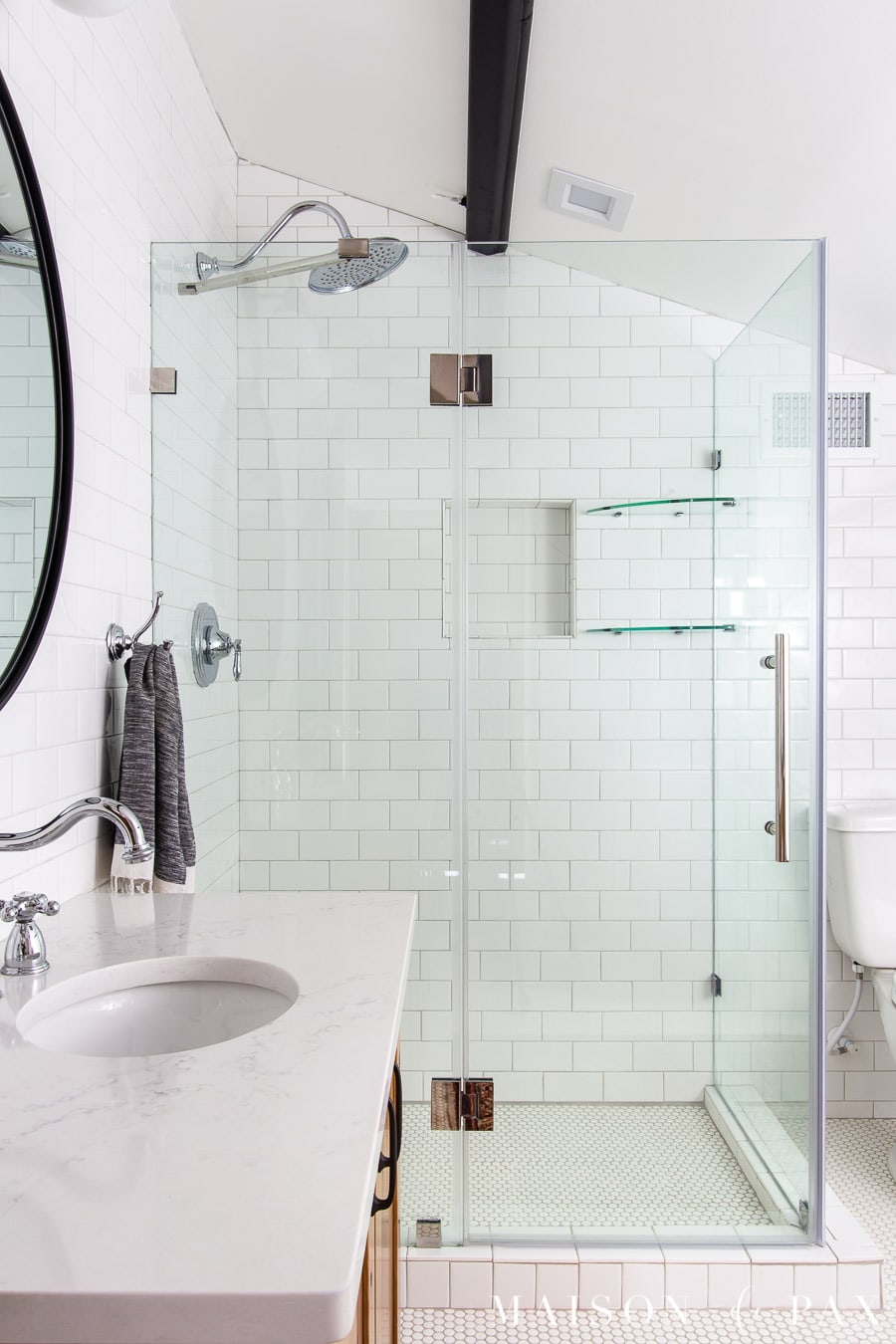 frameless shower door for white tile shower with white quartz countertops | Maison de Pax