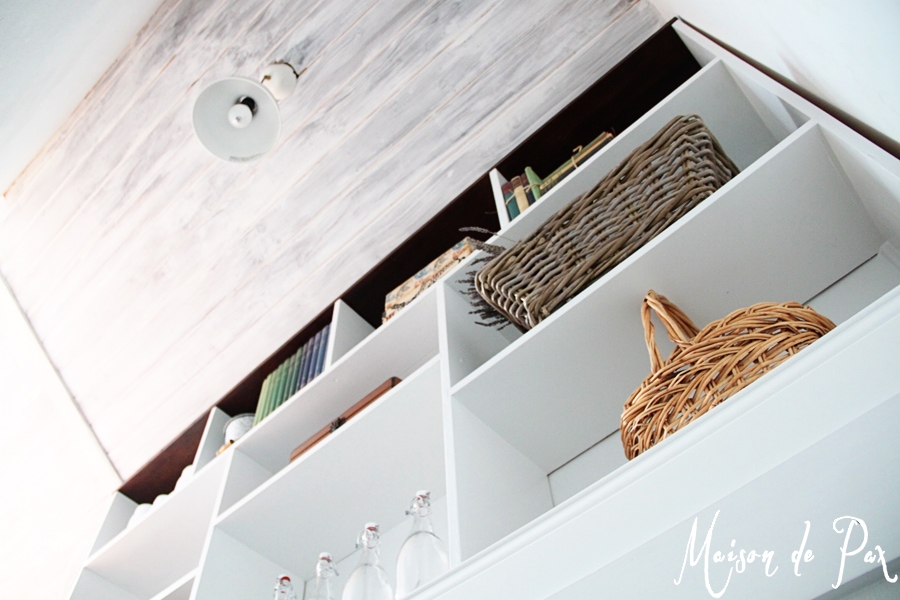 A DIY stairwell bookcase provides a creative and beautiful way to open the space and bring light into the stairwell.  Click through to see details and instructions!