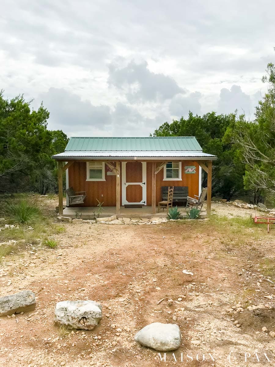 burnt orange tiny house in the country