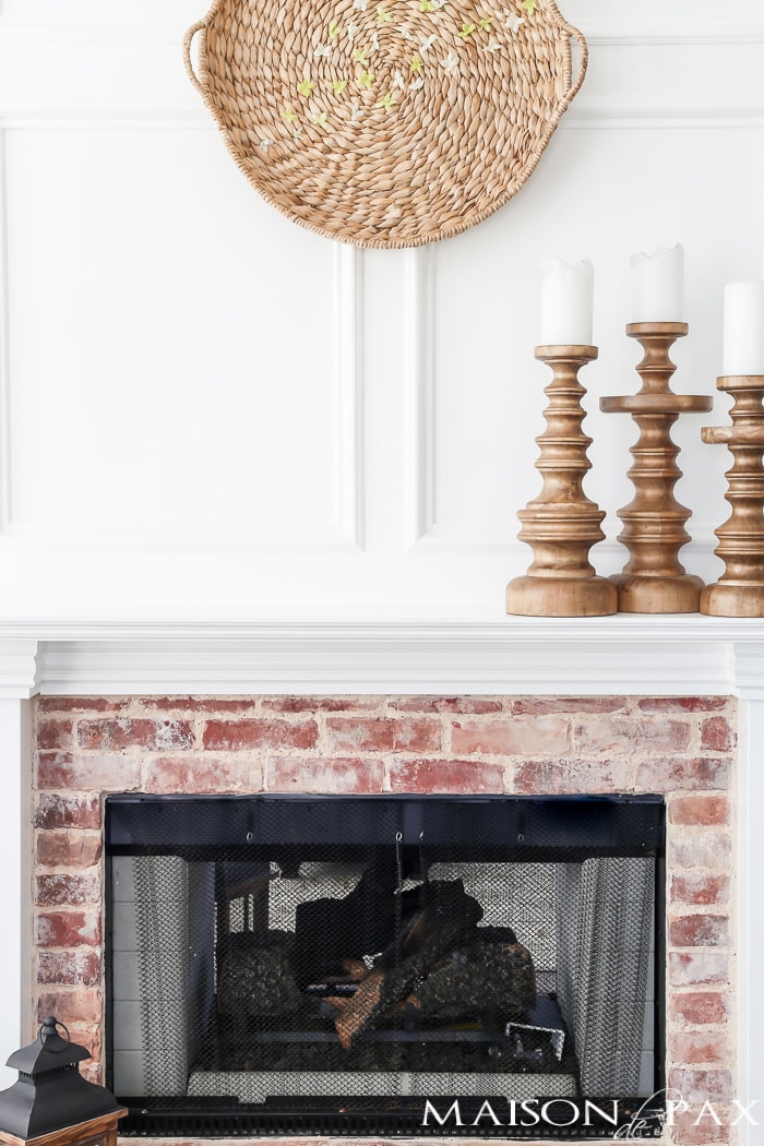 Looking for an easy spring decor idea? In about five minutes, you can turn a simple basket and inexpensive faux flowers into gorgeous spring wall art!