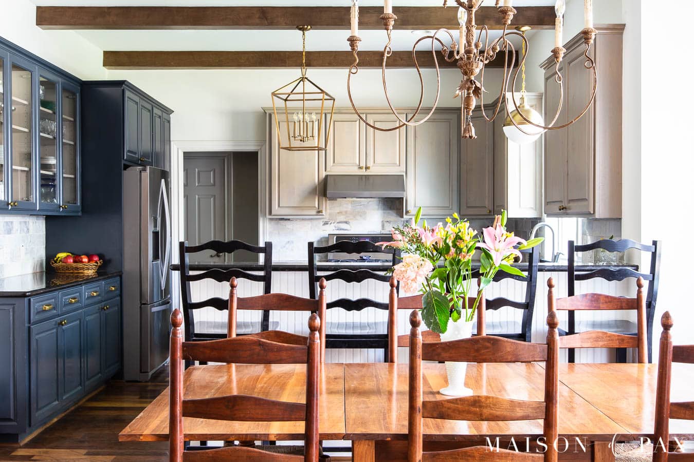 open kitchen and dining room with sw alabster walls and sw cyberspace cabinets