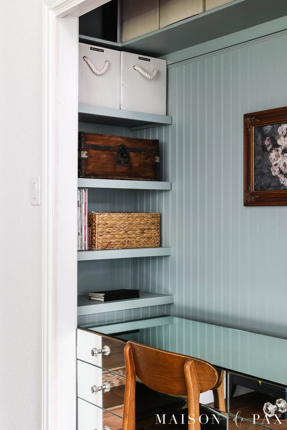 built in storage and shelves in a cloffice