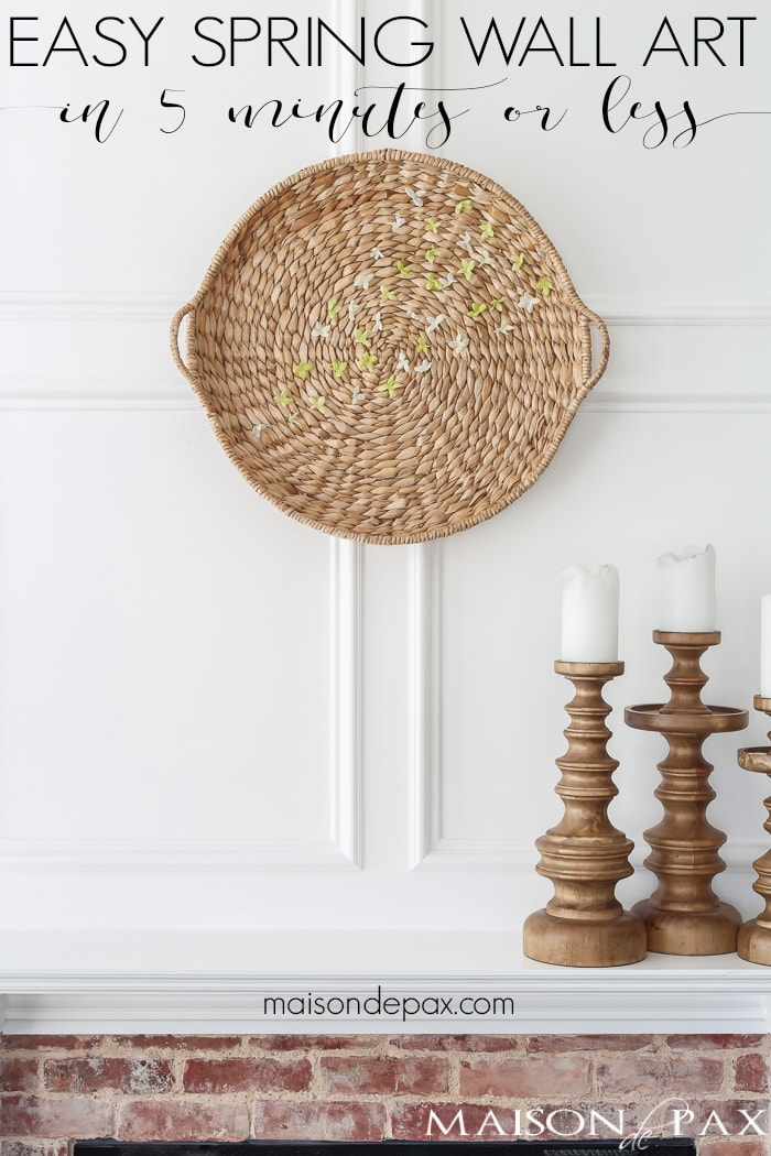 Looking for an easy spring decor idea? In about five minutes, you can turn a simple basket and inexpensive faux flowers into gorgeous spring wall art!