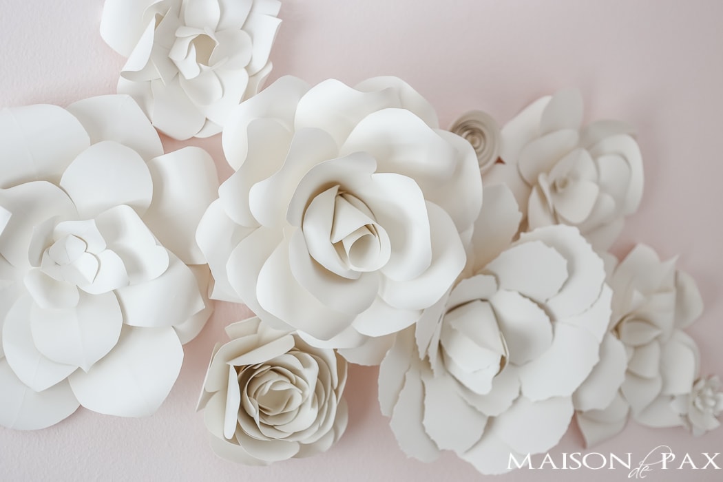 Paper flowers on pink wall- Maison de Pax