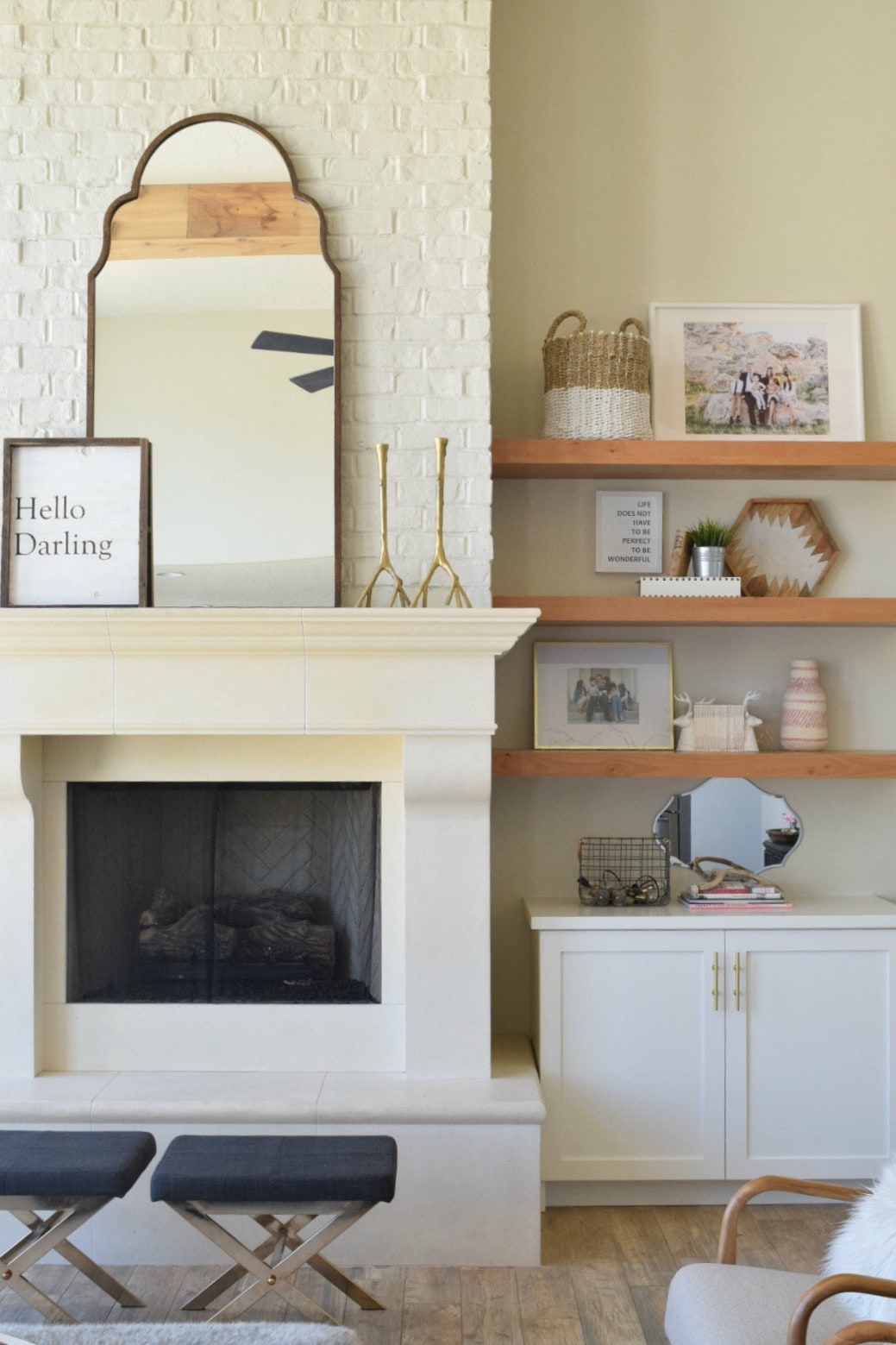 simple cast stone fireplace surround with painted brick chimney
