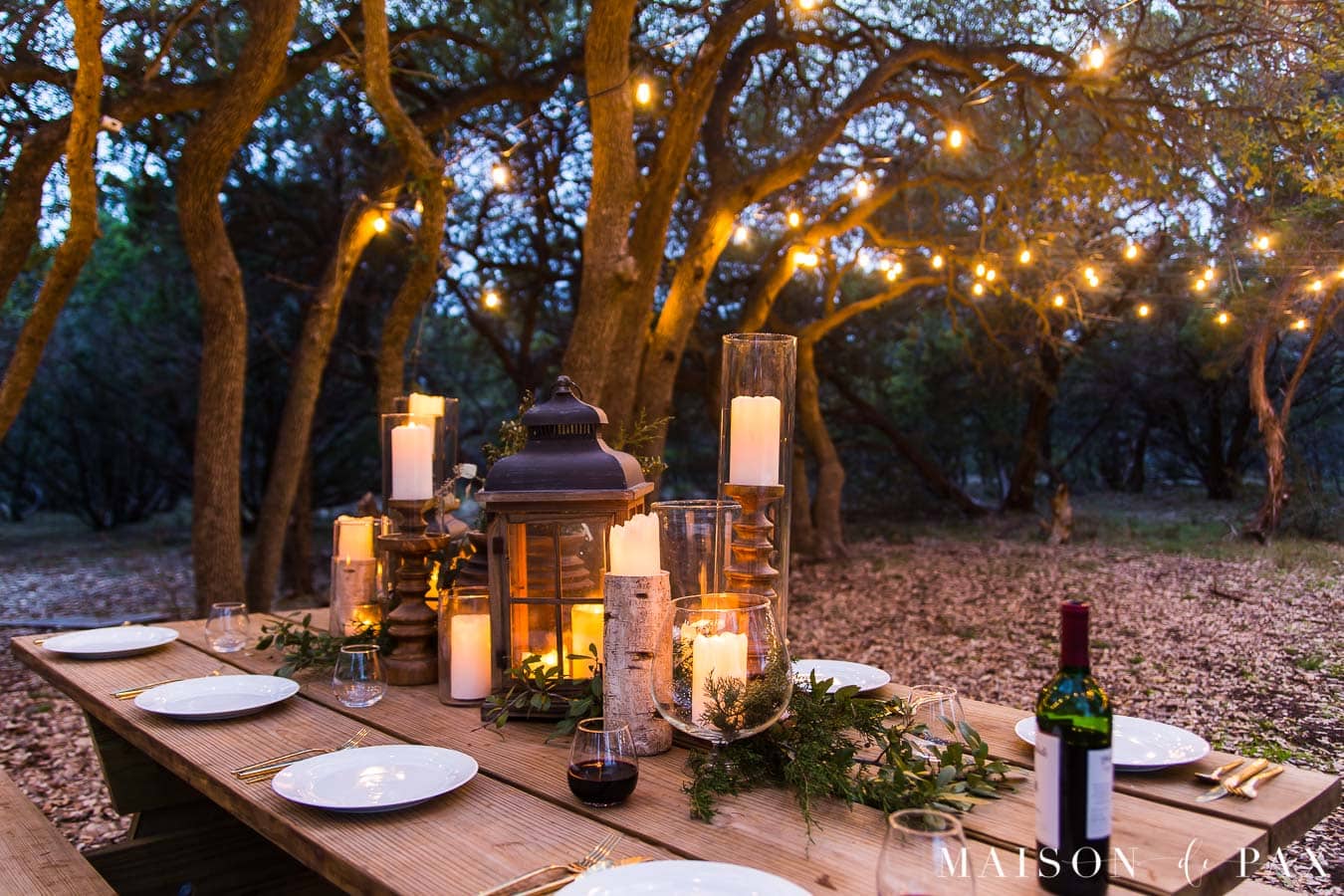 outdoor dining with candles and string lights | Maison de pax