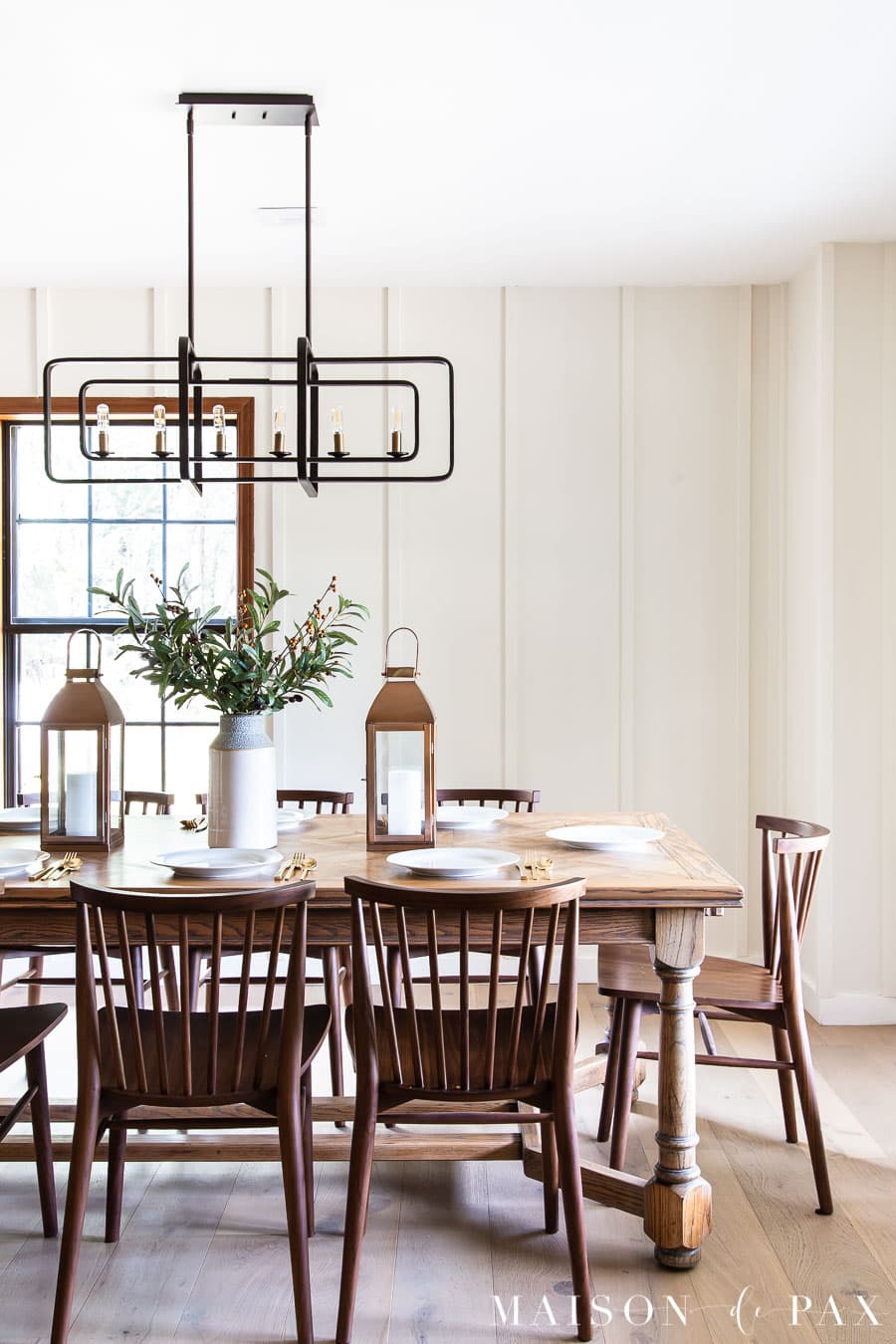 white dining room with board and batten wood wall treatment
