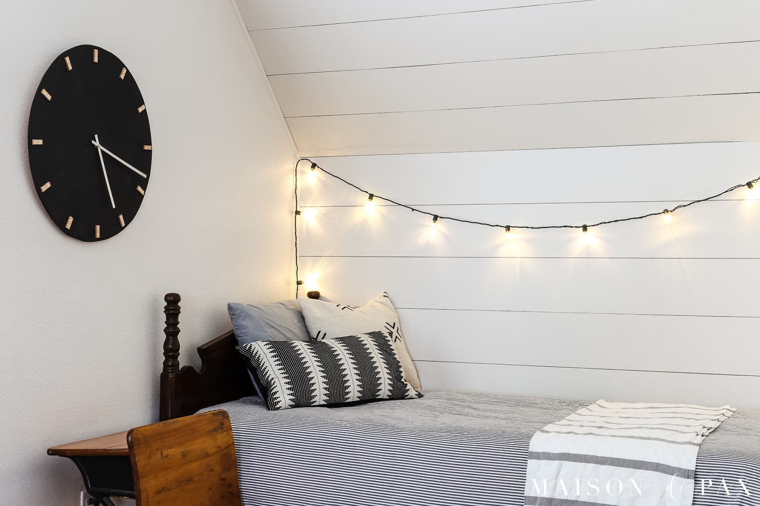 What a cute boy's bed nook!  Learn how to make this DIY black and wood giant wall clock for cheap! #wallart #diywallart #diyclock #wallclock #giantclock #modernfarmhouse #neutraldecor #kidsroom #boyroom #modernfarmhouse #blackandwhiteinteriors