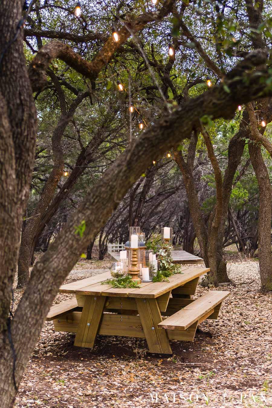 elegant picnic table in arbor | Maison de Pax