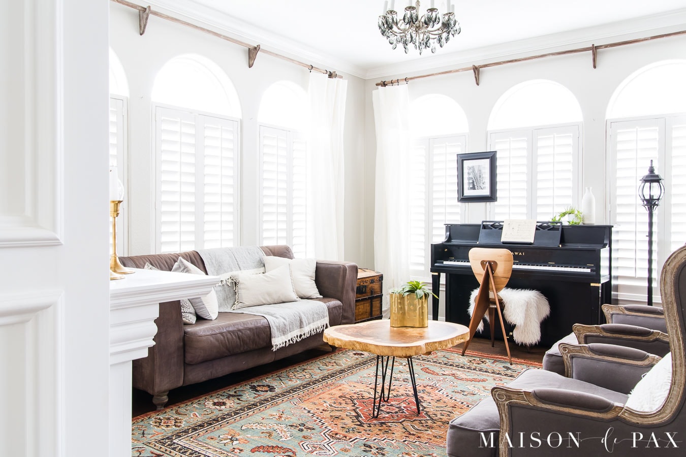 colorful rug log slice coffee table and eclectic living room design | Maison de Pax