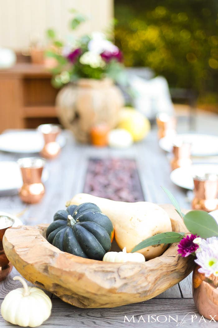 gourds and wooden bowls make a rustic fall table decoration