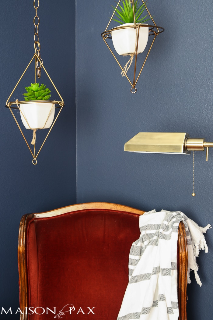 Love this dark, moody, navy office with red and brass accents