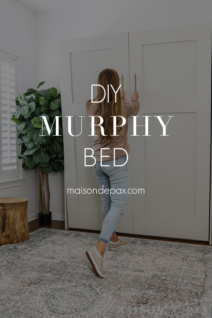woman pulling down murphy bed with text overlay: DIY murphy bed