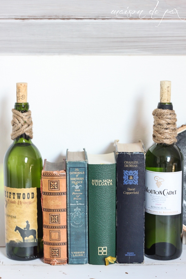 Use empty wine bottles (filled with water or sand) as bookends!  via aiweb9ygdry.cmersite.com