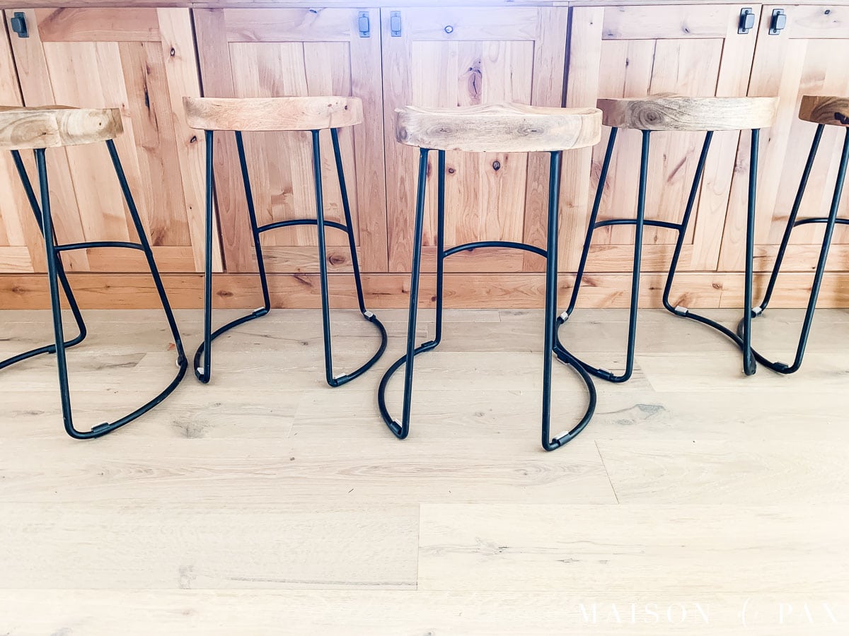 tractor barstools lined up with plastic protectors all twisted