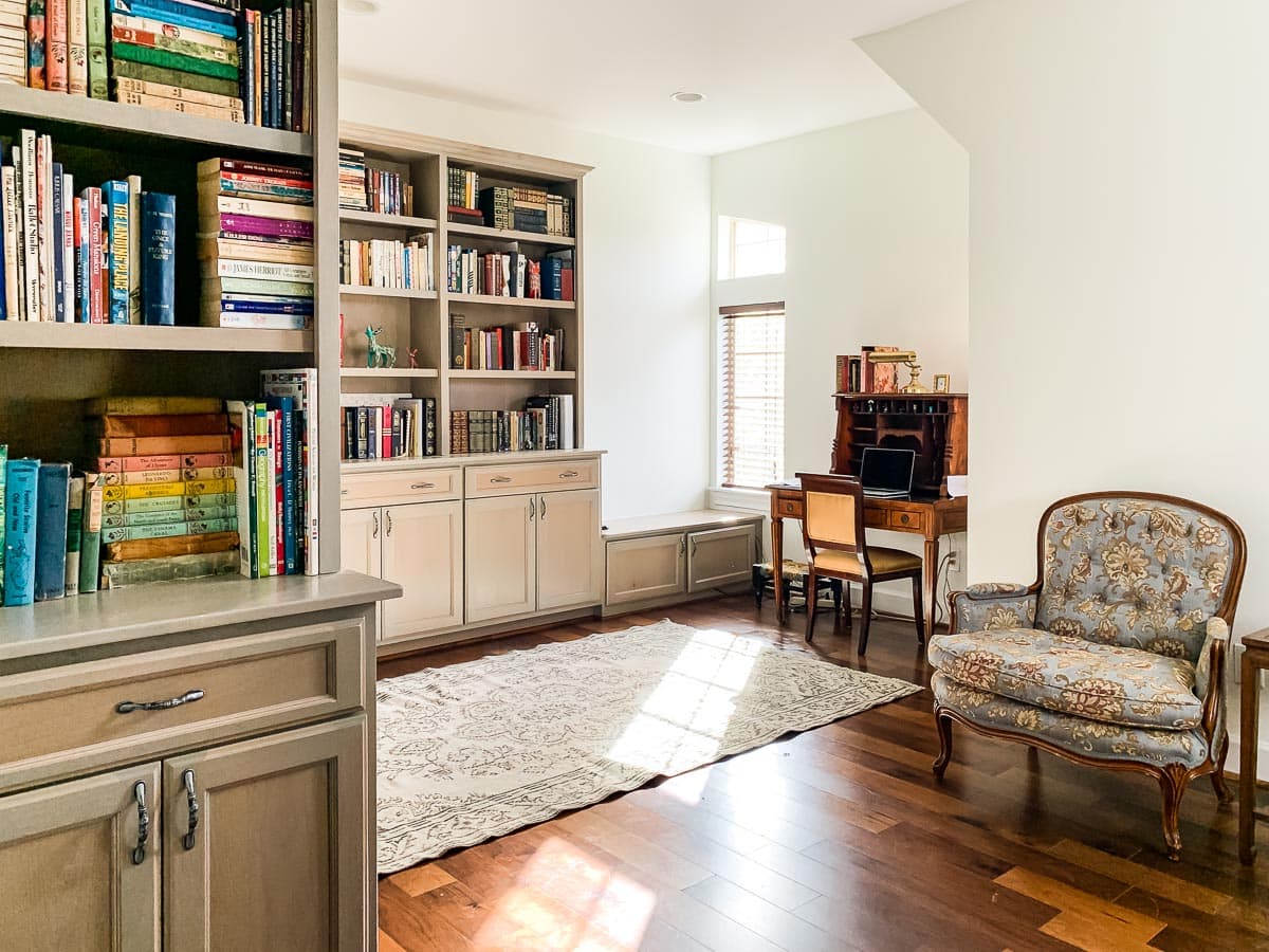 sw alabaster walls with gray wood stained bookcases