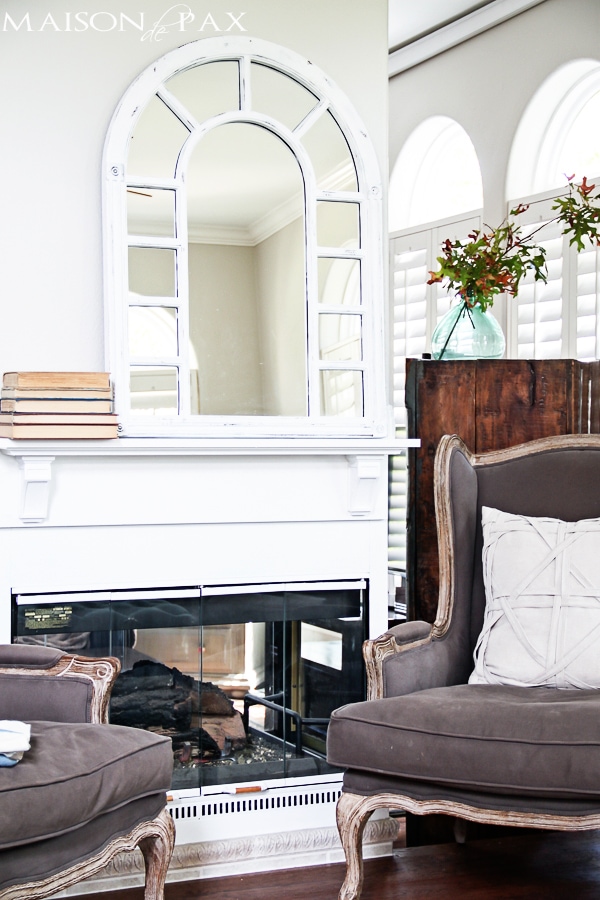 I love this fireplace makeover! Some paint, a simple mantel, and a total transformation of this formerly dated black box fireplace | aiweb9ygdry.cmersite.com