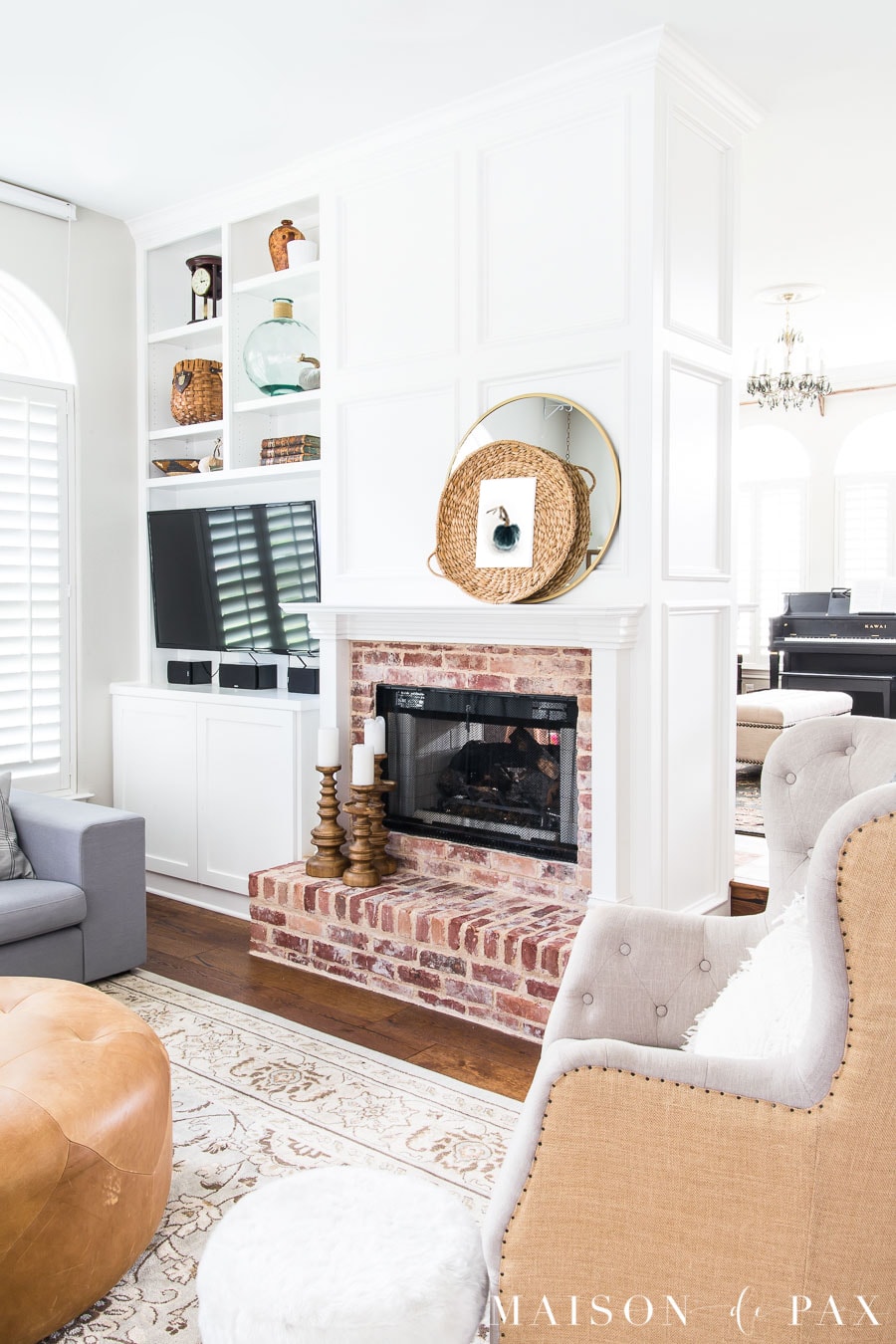 White fireplace molding and antique brick fireplace- Maison de Pax