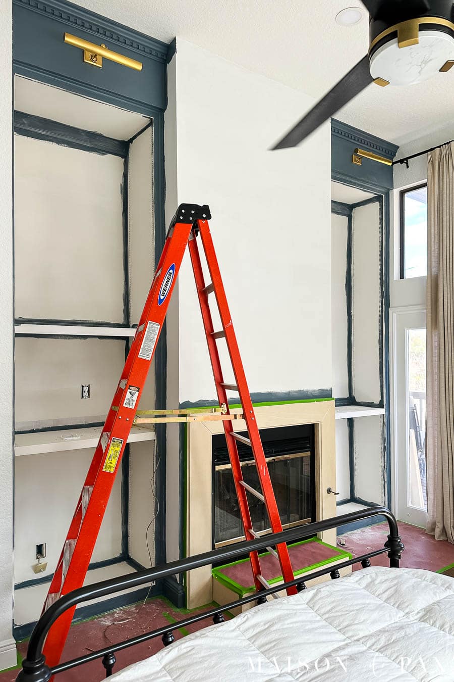 adding crown molding to bookcases on either side of fireplace