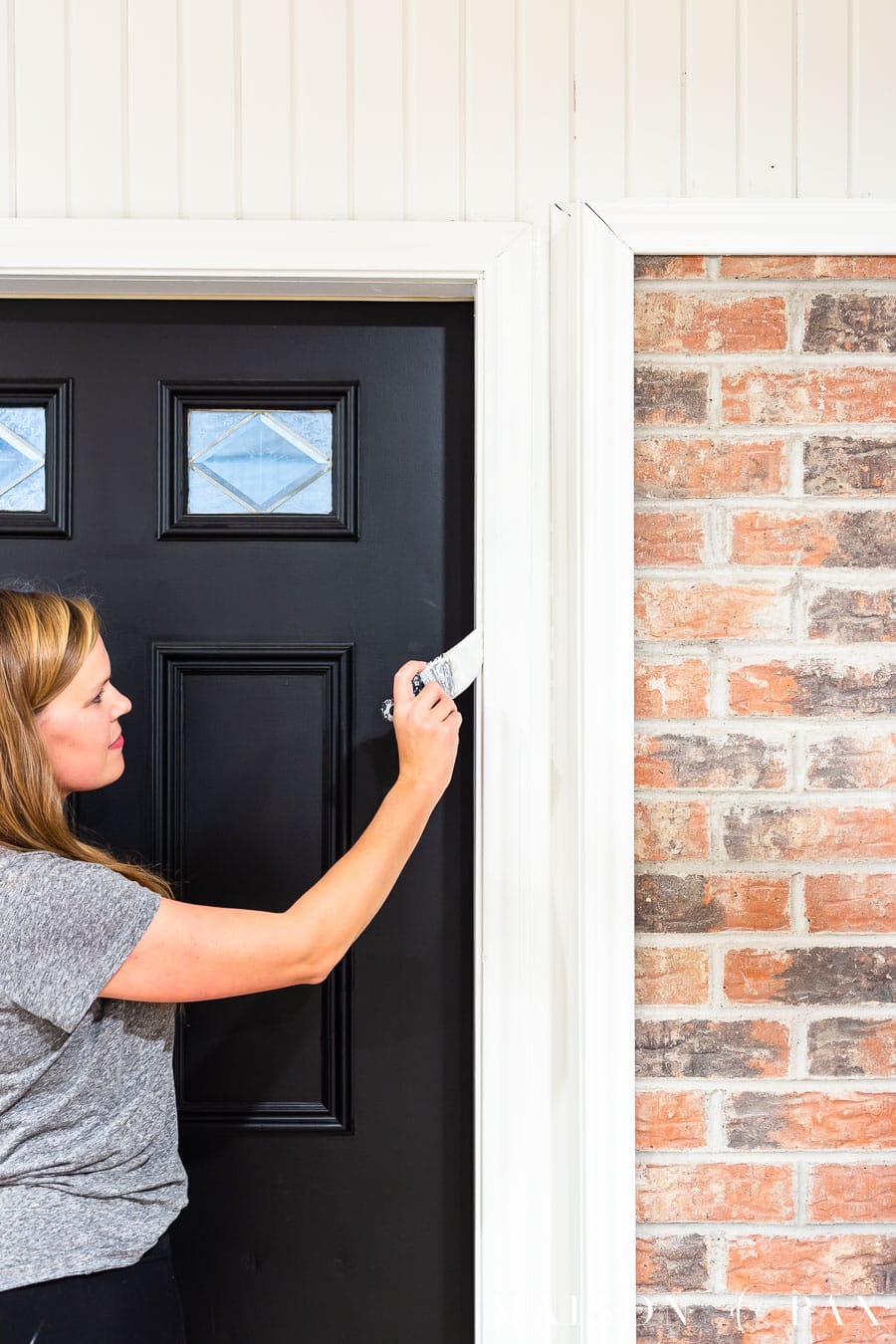 woman painting trim
