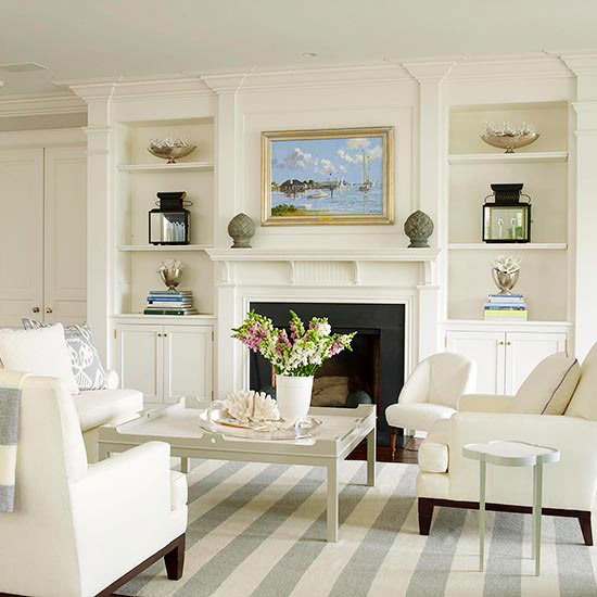 fireplace with white mantel, moldings, and built in bookcases- Maison de Pax