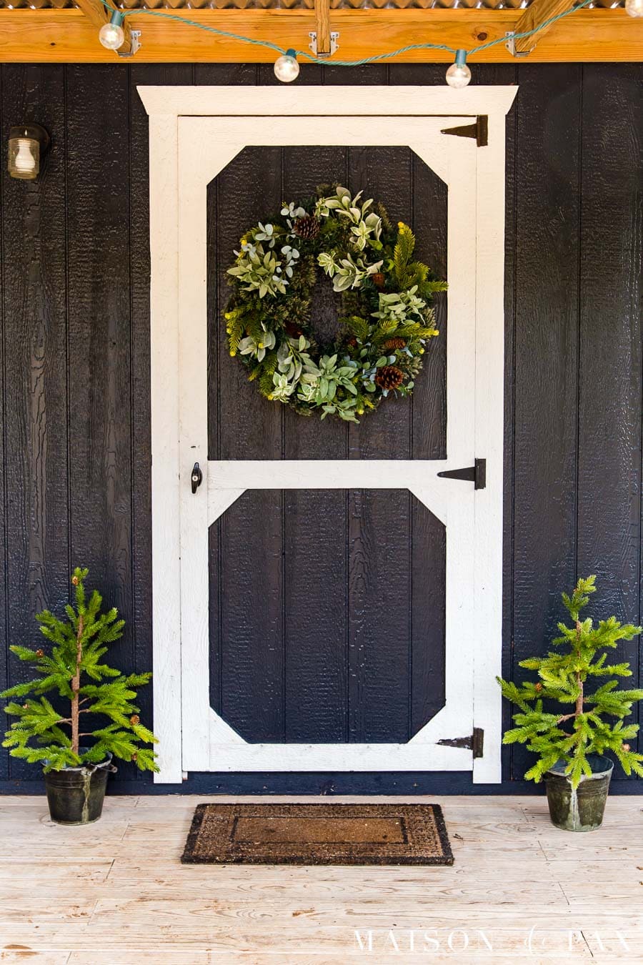 black barn door with white trim