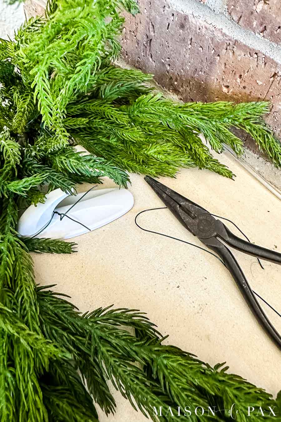 use floral wire to hang garland with command hooks