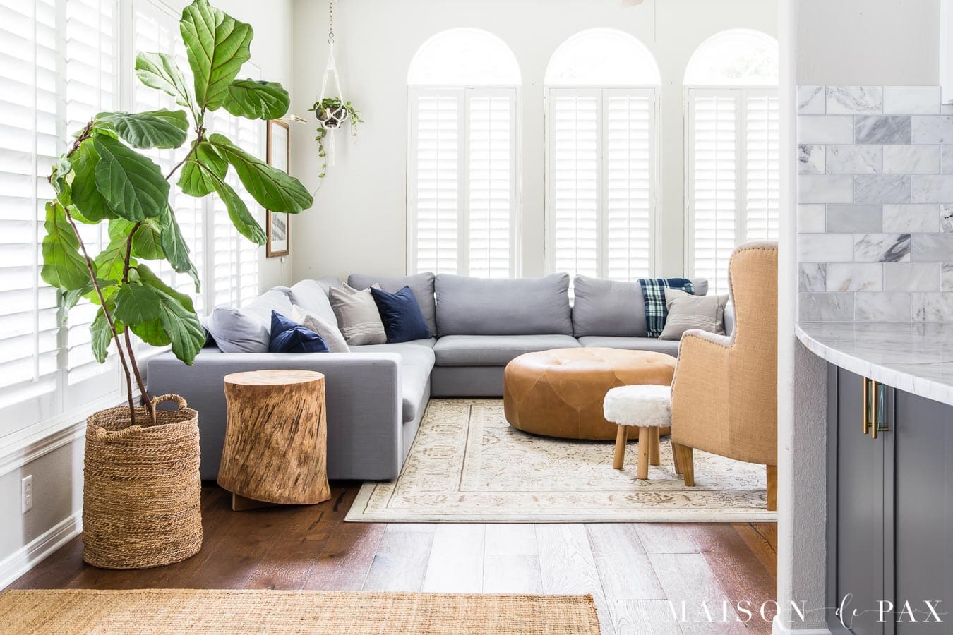 Gray, white, and navy living room with warm netural textures - Maison de Pax