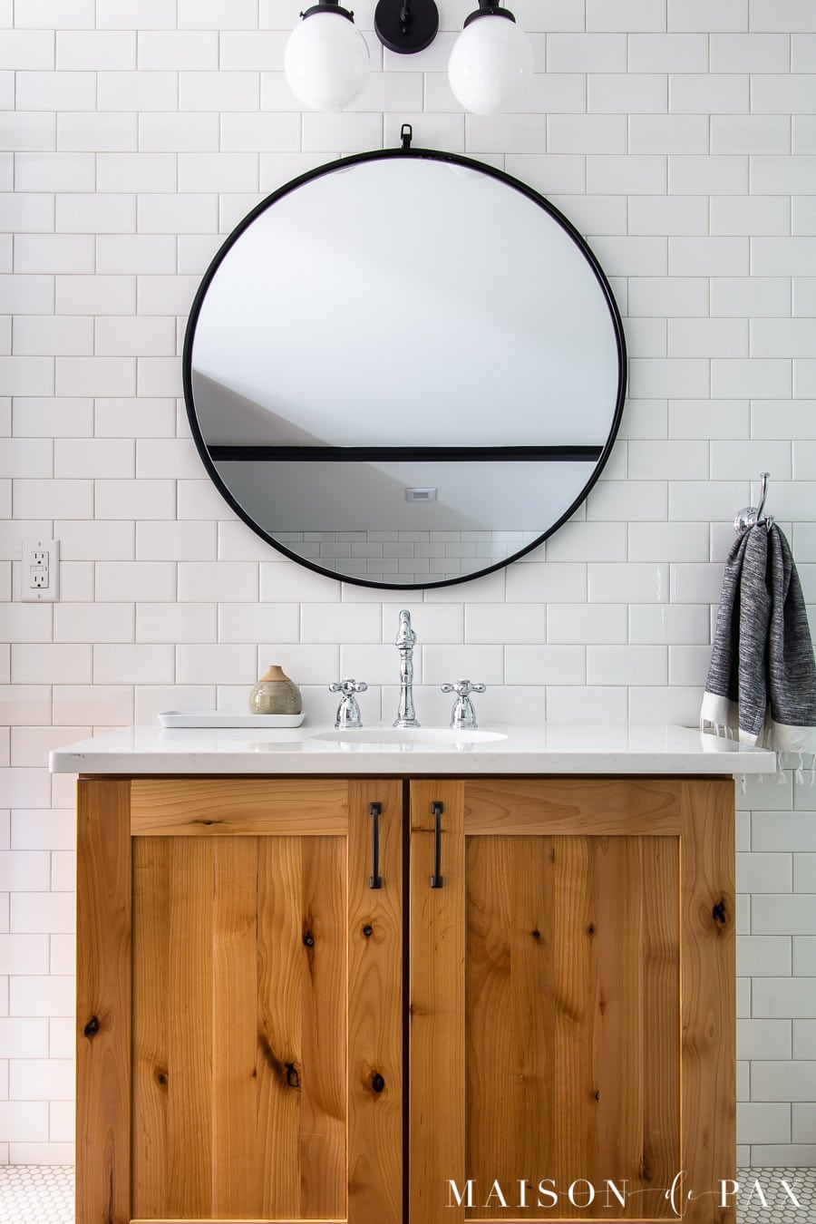 wood vanity with white quartz counter and white subway tile backsplash | Maison de Pax