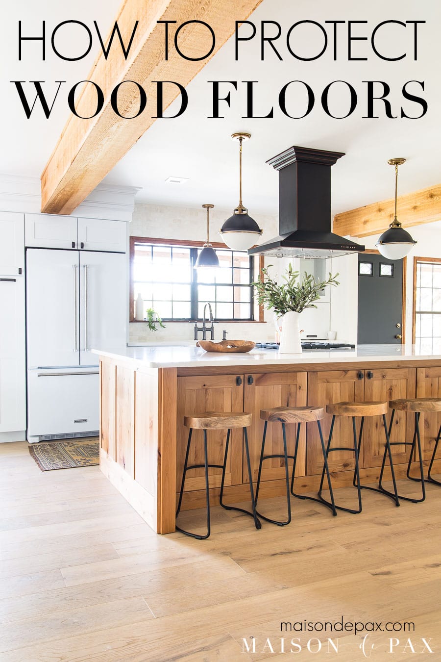 kitchen with light oak wood floors and text overlay: how to protect wood floors | Maison de Pax