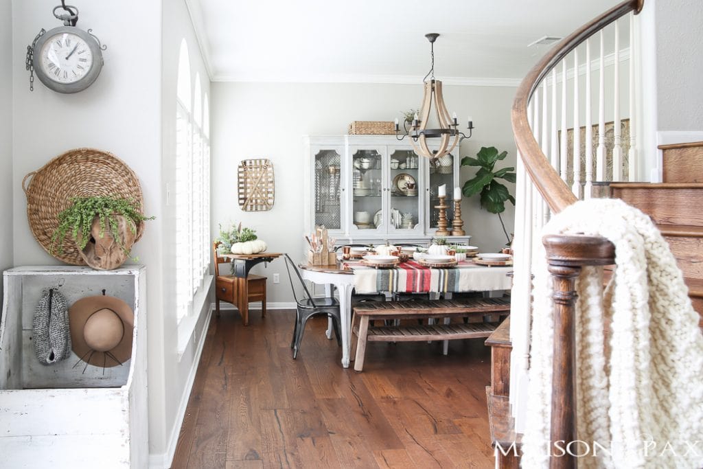 Be inspired to create a gorgeous, rustic Thanksgiving tablescape with these Thanksgiving decorating ideas! This table incorporates plaid, copper, and wood to create a beautiful yet relaxed look.