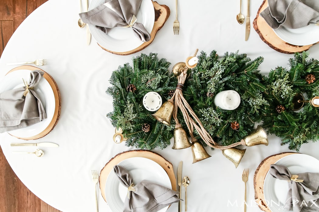 natural centerpiece of green wreaths and brass candelsticks - Maison de Pax