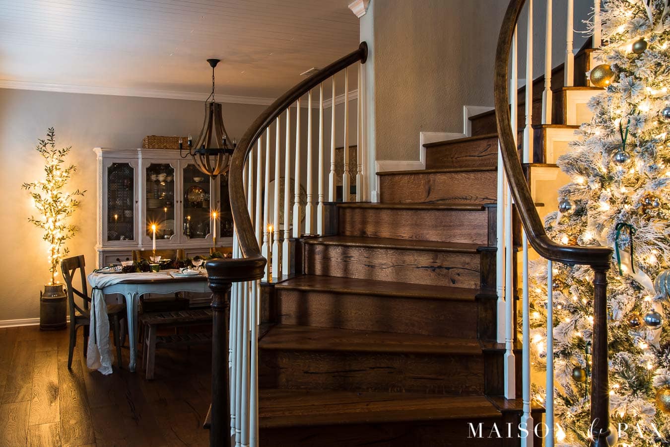 curved stairscase with Christmas tree and string lights | Maison de Pax