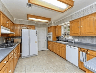 Old kitchen with oak cabinets- Maison de Pax
