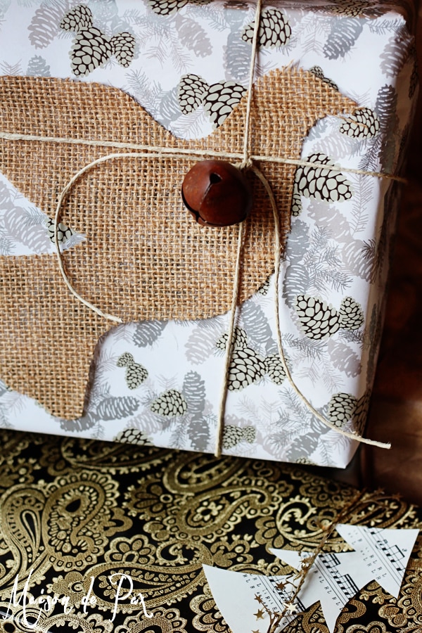 simple and stunning gift wrap ideas: burlap silhouette against metallic paper