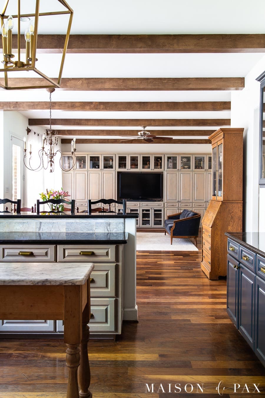 open kitchen living with built in cabinets in gray wood