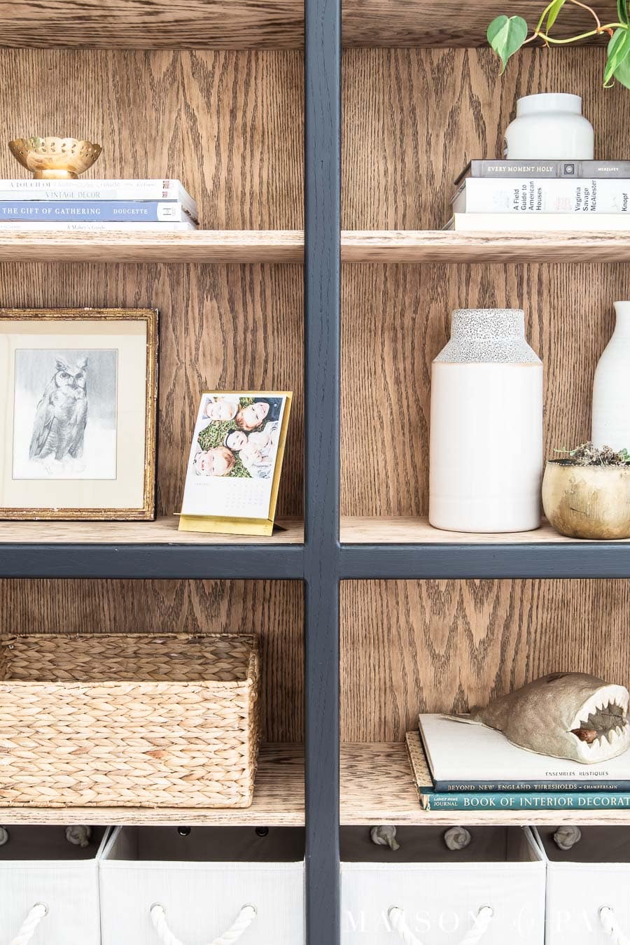 black and wood bookcase with natural wood look inside | Maison de Pax