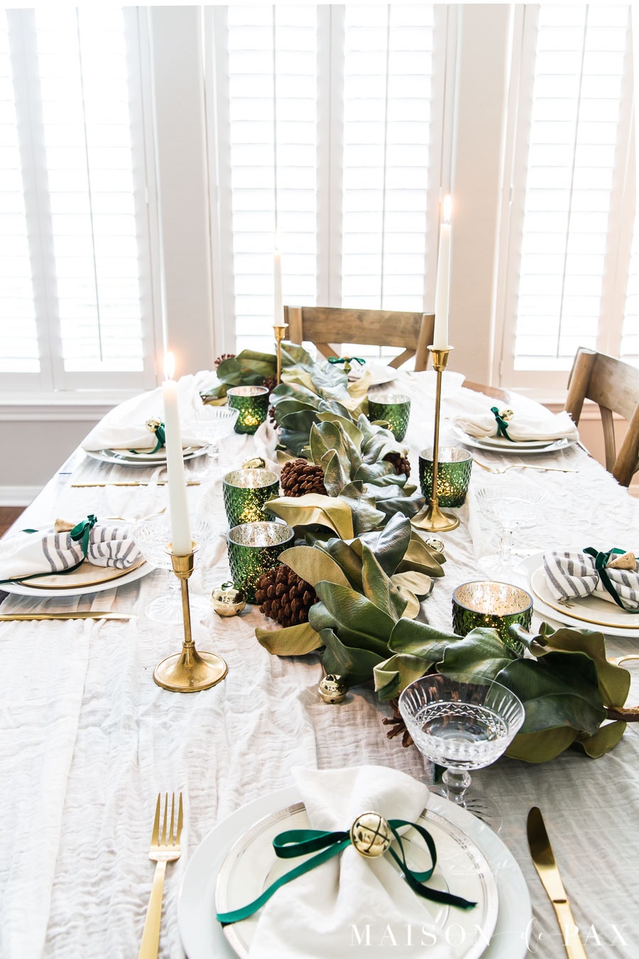 cloth napkins tied with ribbons and bells for Christmas table | maison de pax